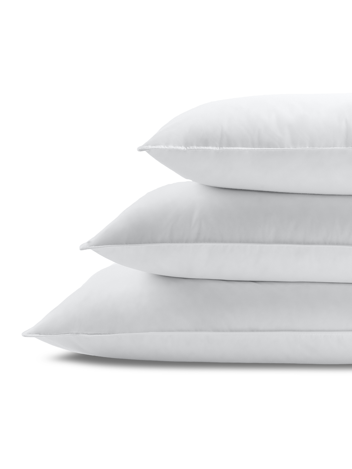 Stack of three rectangular white pillows, with visible stitching, flat, smooth, and in Signature White color.