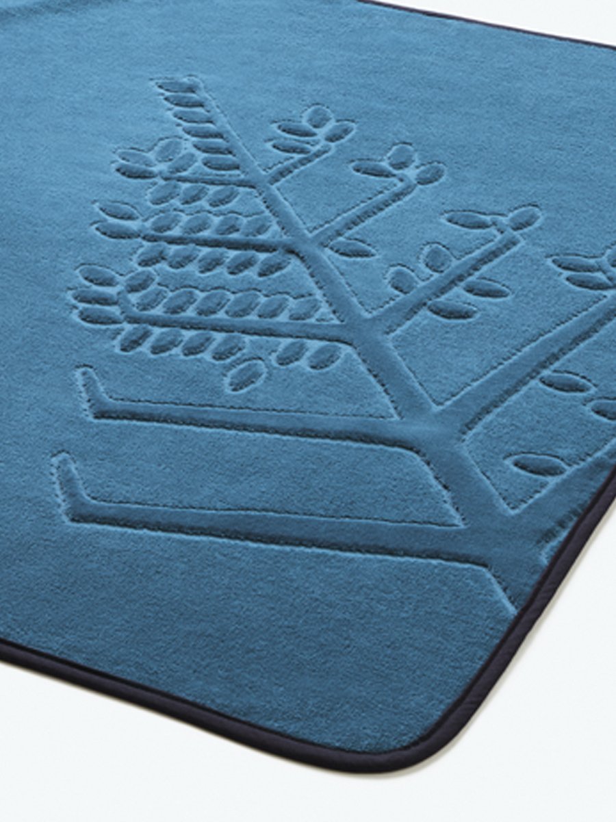 Close-up of a "Underwater Blue" hooded baby towel with an embroidered Four Seasons logo.