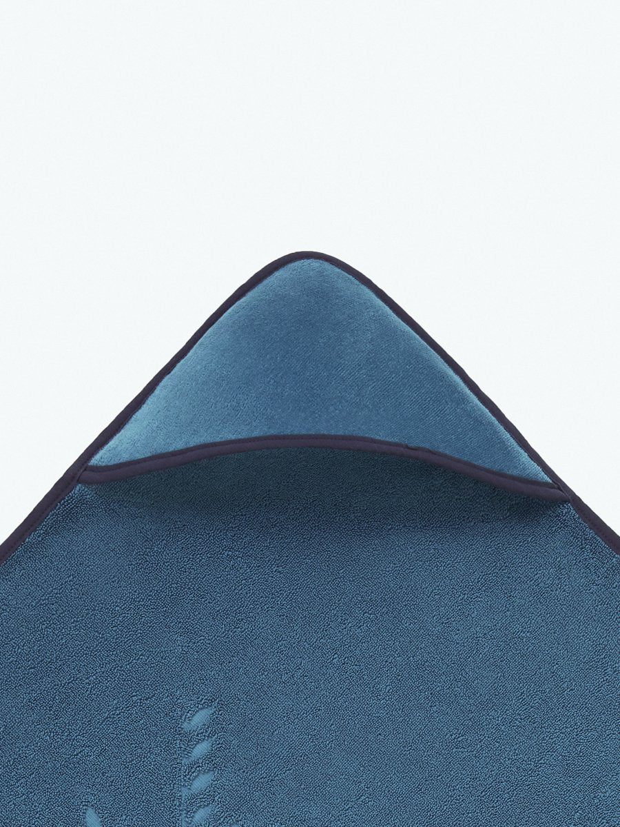 Close-up of the hooded end of a "Underwater Blue" baby towel.