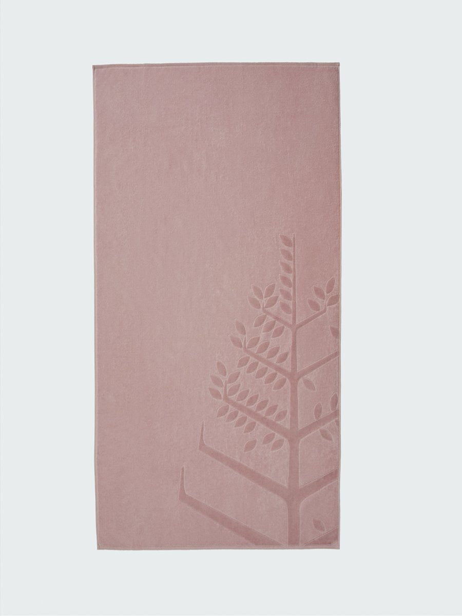 A 'Hawaiian Sunrise' beach towel with the Four Seasons logo embossed on it.