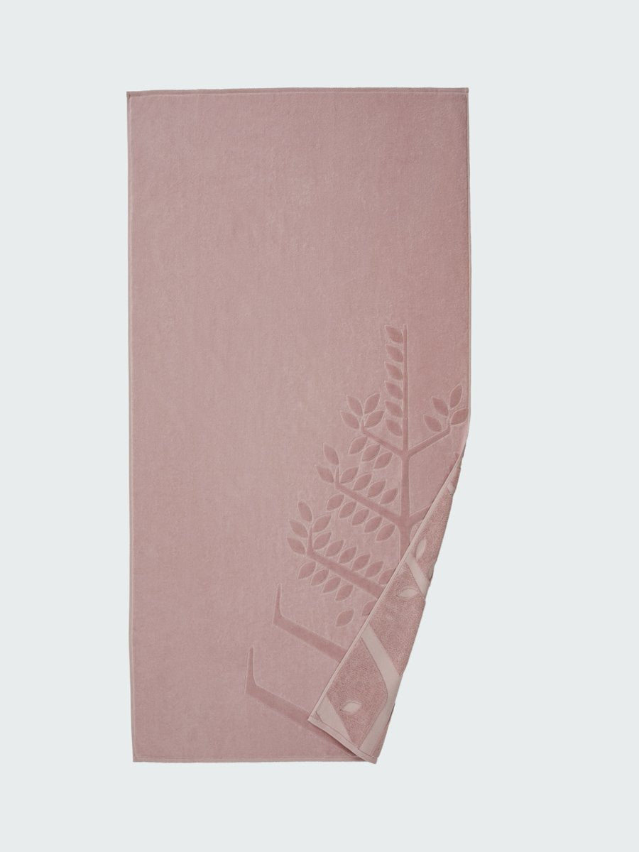 'Hawaiian Sunrise' beach towel with an embossed Four Seasons logo. Part of the towel is folded back to reveal the same design on the bottom.