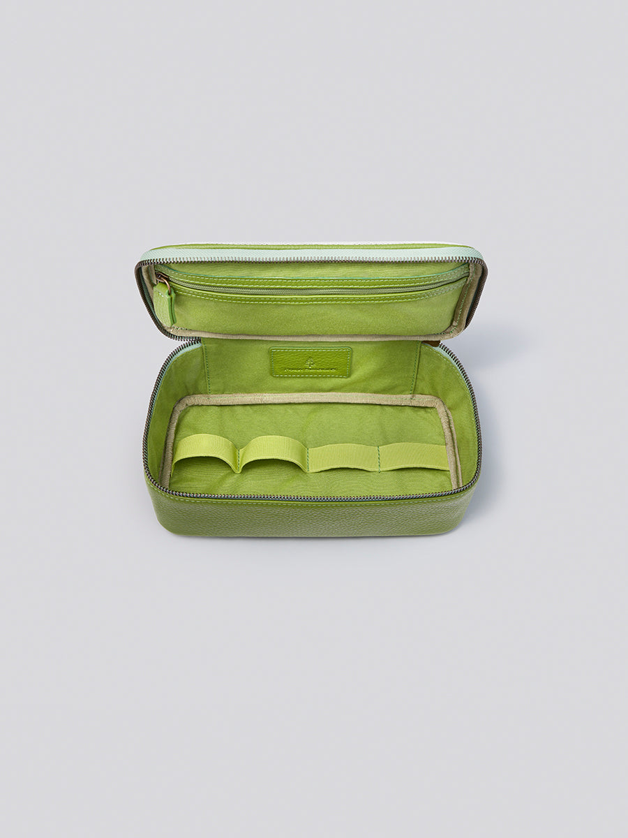 The Tech Case, showcasing its well-organized interior with dedicated compartments for keeping tech accessories tidy and organized.