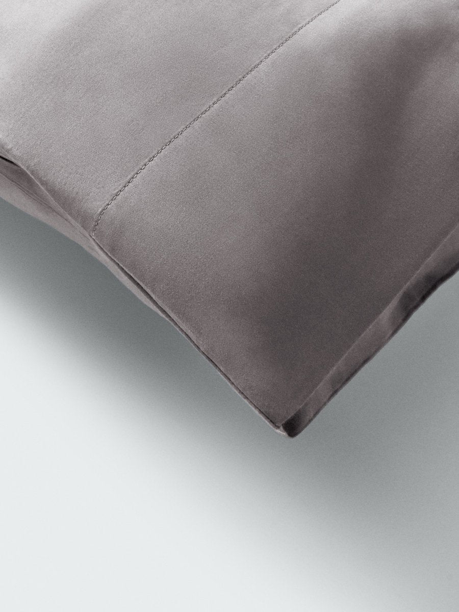 Part of a pillow with a pillowcase in Hampshire Charcoal color.
