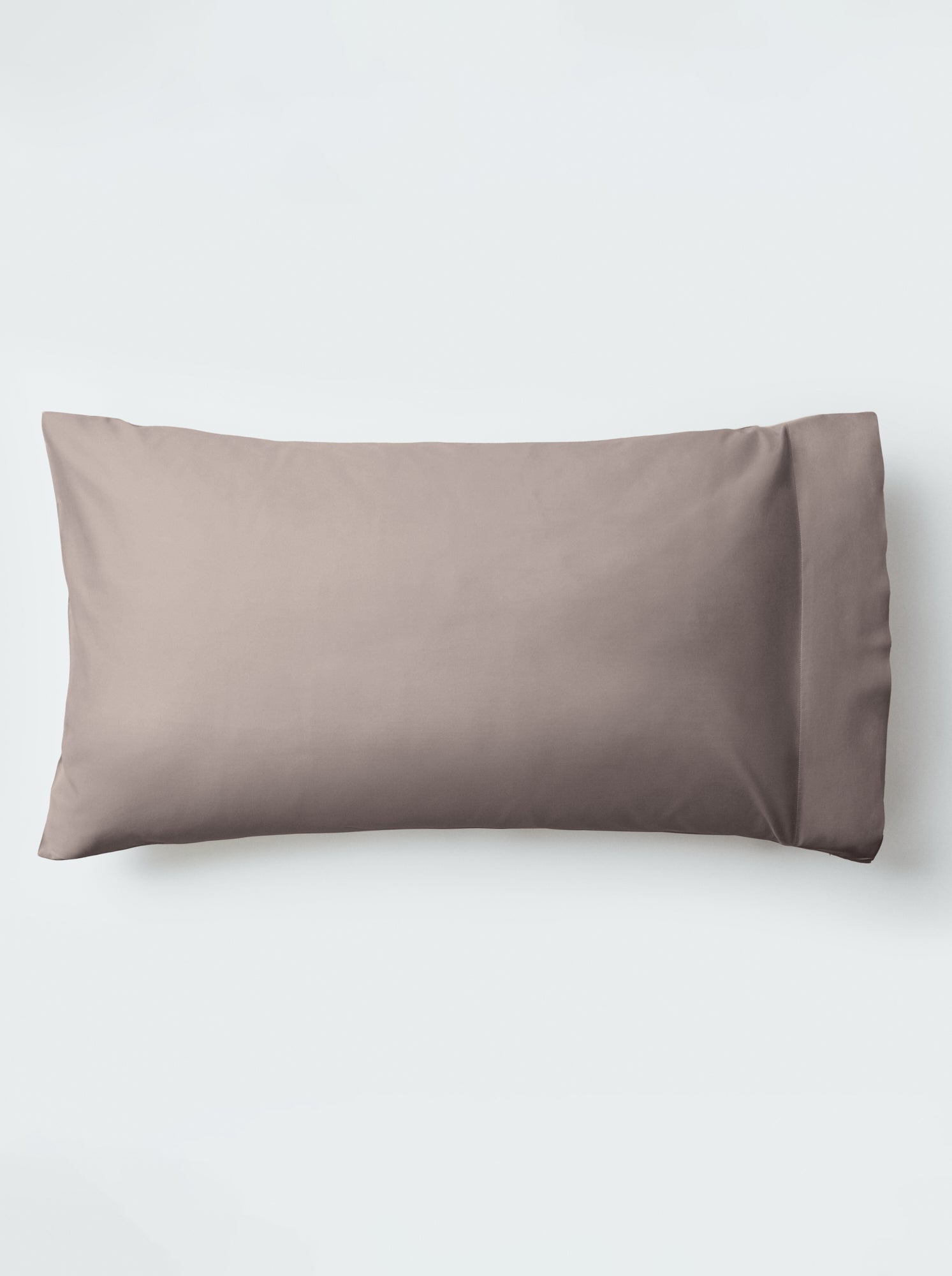 A pillow with an elegant Moroccan Sand color pillowcase.