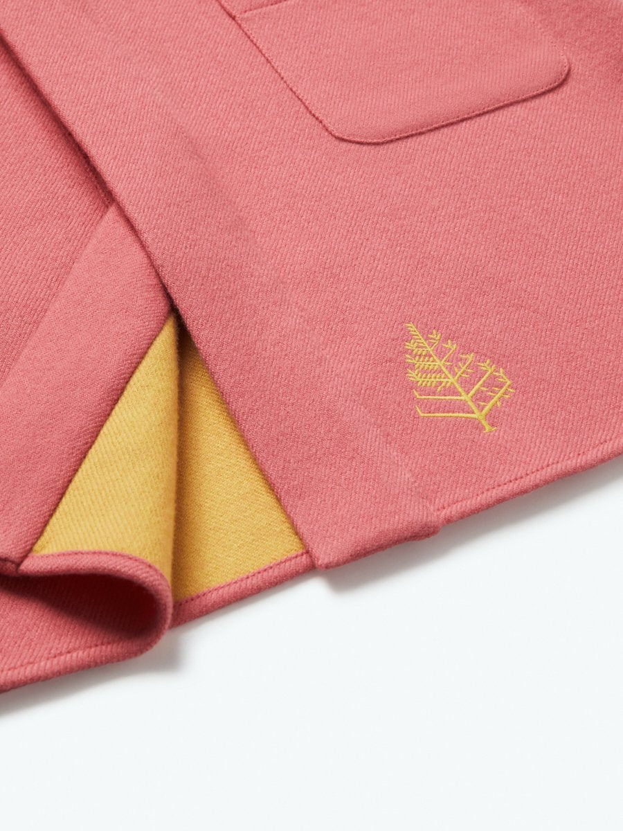 The exterior of the robe showcases a soft and uniform Coral Reef Pink tone, creating a pleasing visual contrast.