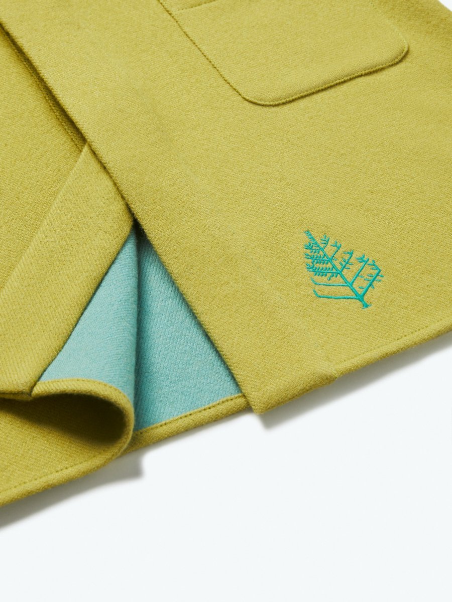 The exterior of the robe showcases a soft and uniform Mangrove Green tone, creating a pleasing visual contrast.