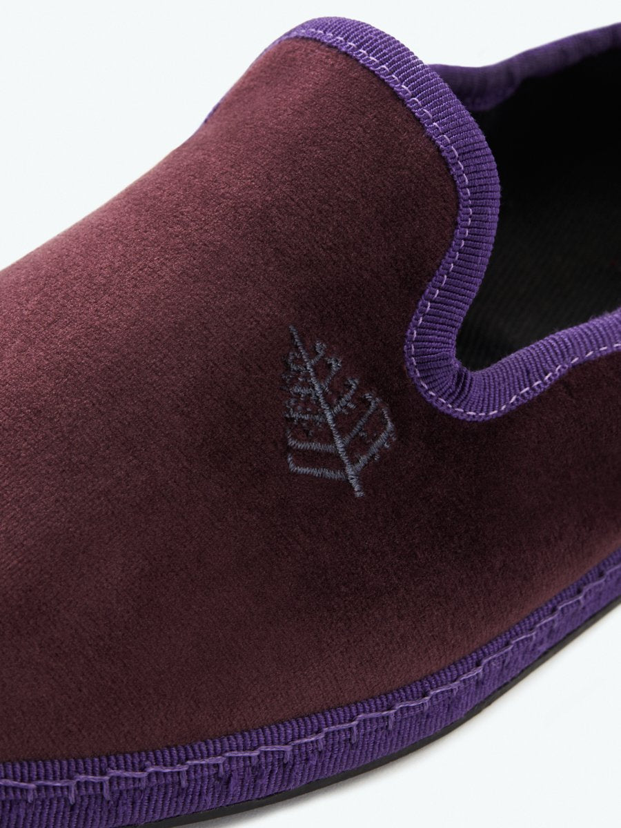 Close-up of the Four Seasons Velvet Slippers in Napa Cabernet, showcasing the embroidered Four Seasons logo.