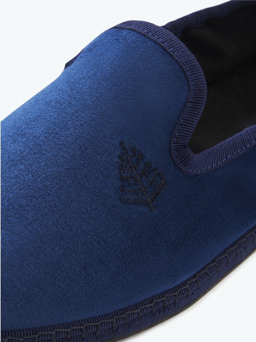 Close-up of the Four Seasons Velvet Slippers in Riviera Navy, showcasing the embroidered Four Seasons logo.