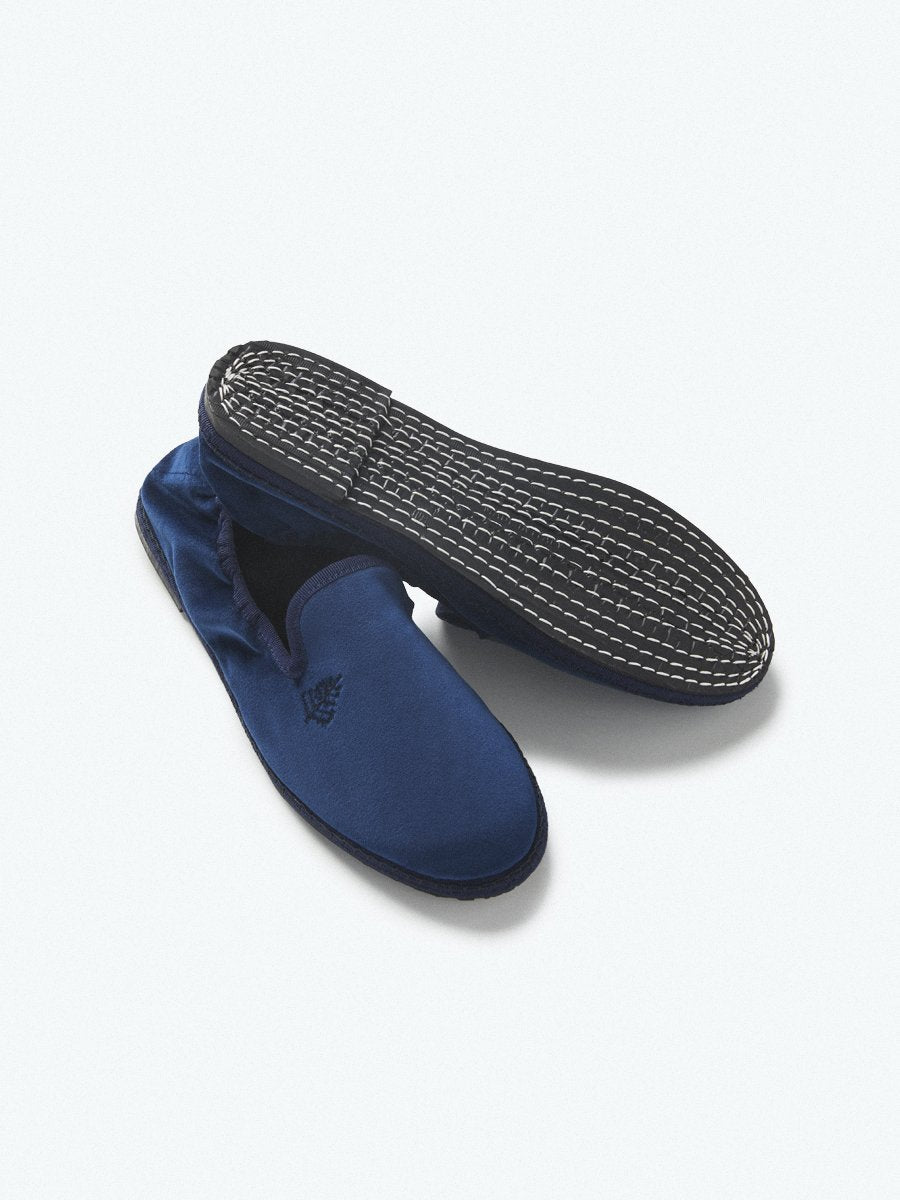 Close-up of the Four Seasons Velvet Slippers in Riviera Navy, showcasing the luxurious velvet fabric and artisanal hand-stitching.
