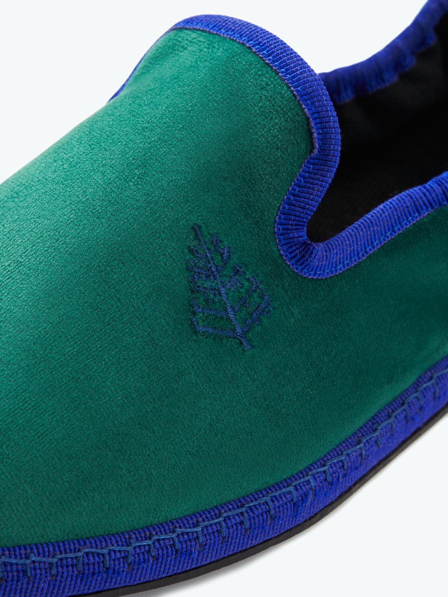 Close-up of the Four Seasons Velvet Slippers in Anguilla Green, showcasing the embroidered Four Seasons logo.