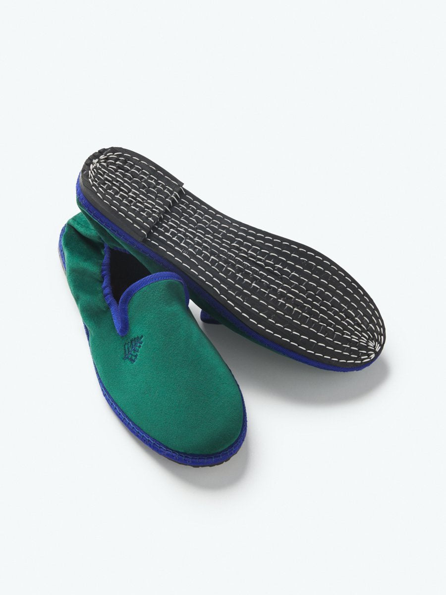 Close-up of the Four Seasons Velvet Slippers in Anguilla Green, showcasing the luxurious velvet fabric and artisanal hand-stitching.