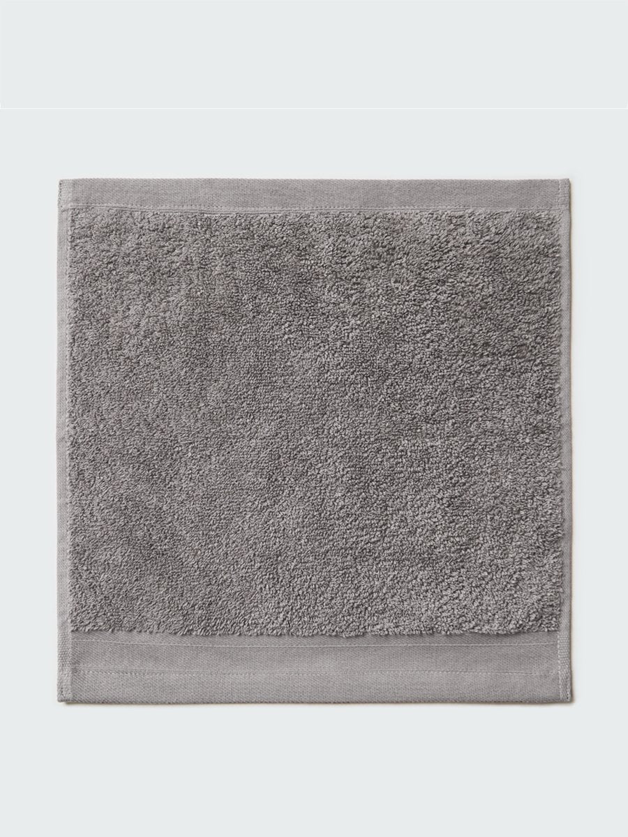 Close-up of a "Hampshire Charcoal" colored bath wash cloth , visible fabric