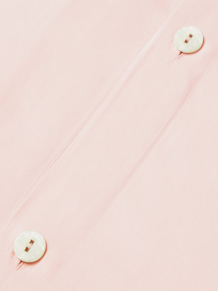 An elegant Kyoto Blush-colored duvet with a button closure.