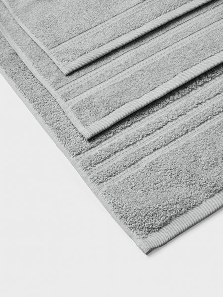 towel set in Spanish Slate, finished with a patterned dobby border.
