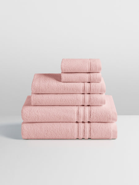 6-piece colored towel set in Kyoto Blush, finished with a patterned dobby border.