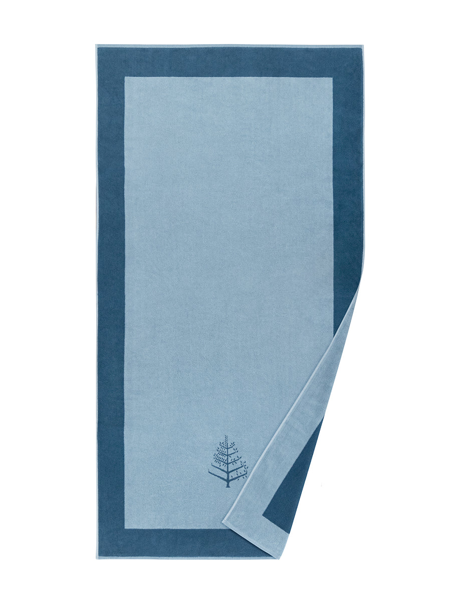 A "Maldivian Atoll" Resort Towel with a subtle embroidered Four Seasons logo. The towel features a darker border and is folded on a white background.