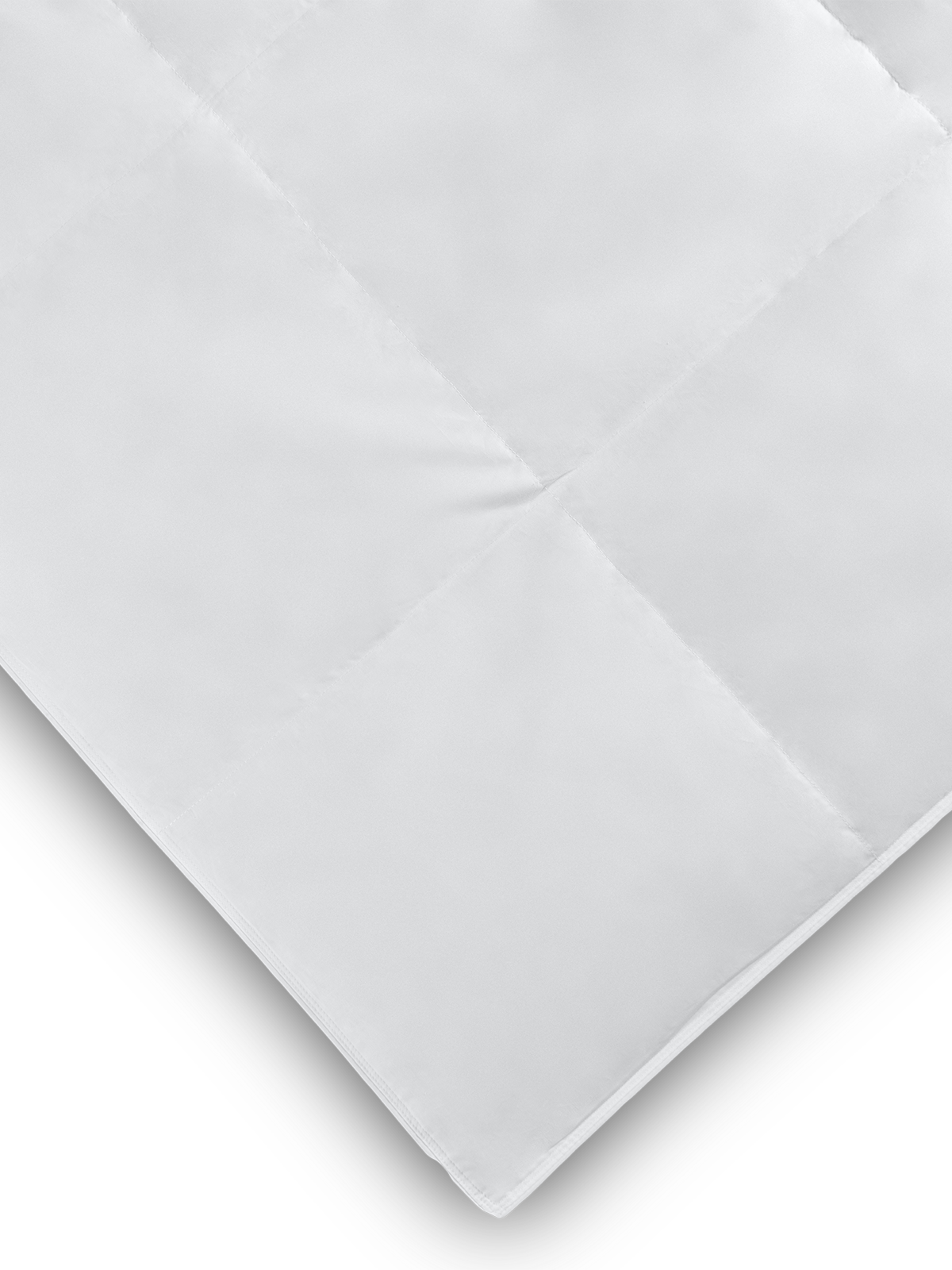 Close-up of a white down duvet showing its quilted pattern and soft texture.