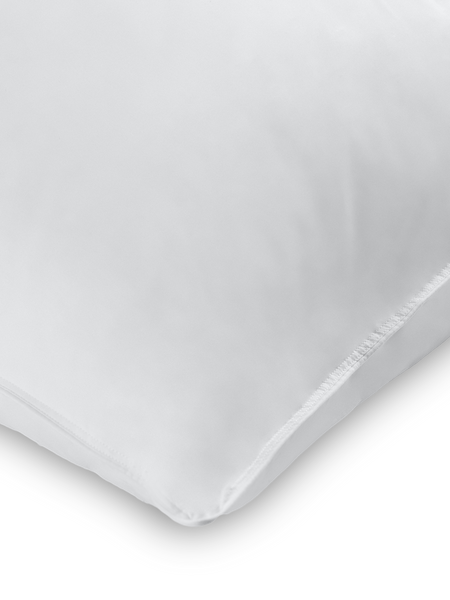 Close-up of a corner of a Signature White color pillow.
