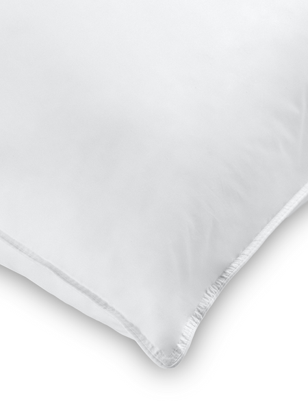Soft, fluffy white rectangular pillow. Ideal for resting and sleeping comfortably.