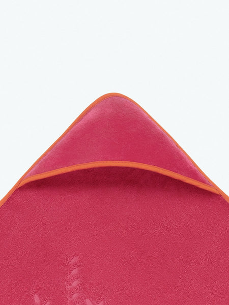 Close-up of the hooded end of a "Coral Reef Pink" baby towel.