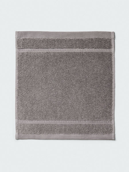 Close-up of a "Hampshire Charcoal" colored bath wash cloth , visible fabric