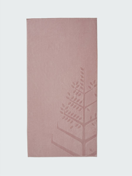 A 'Hawaiian Sunrise' beach towel with the Four Seasons logo embossed on it.