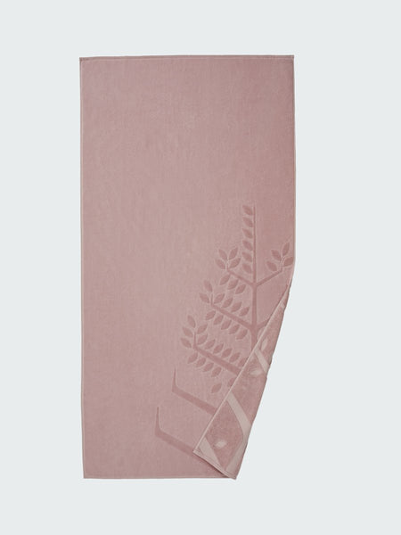  'Hawaiian Sunrise' beach towel with an embossed Four Seasons logo. Part of the towel is folded back to reveal the same design on the bottom.