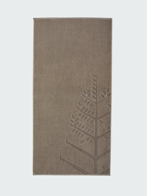 A "Californian Driftwood" beach towel with the Four Seasons logo embossed on it.