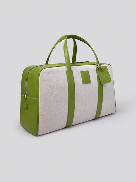 The Bowler travel bag, a versatile and stylish carry-on with a sleek design, crafted from Italian Pebble Grain Leather and Organic Cotton Toile.