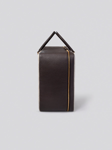 Side view of The Valisette travel bag in Malaysian Cocoa from the Four Seasons Travel Collection.