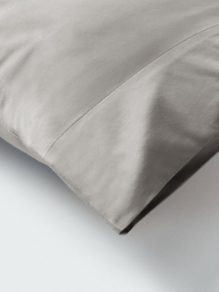 Part of a pillow with a pillowcase in Spanish Slate color.