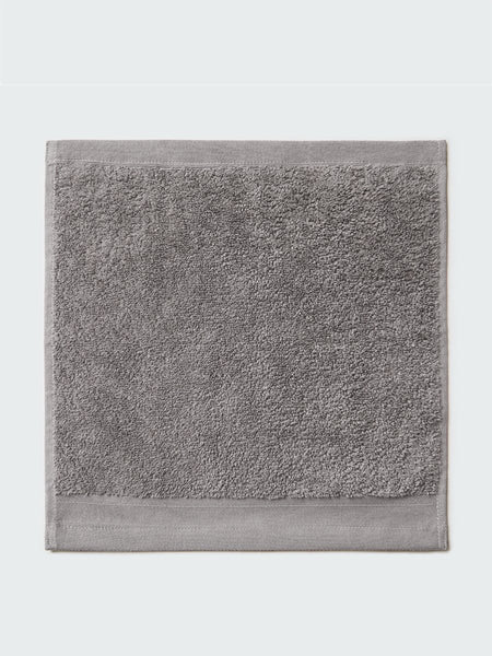 Close-up of a "Hampshire Charcoal" colored bath wash cloth , visible fabric